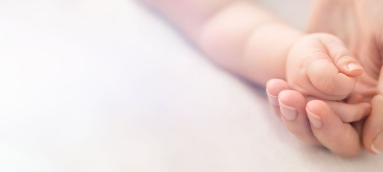 A little baby hand in mothers palm A little baby hand in mothers palm